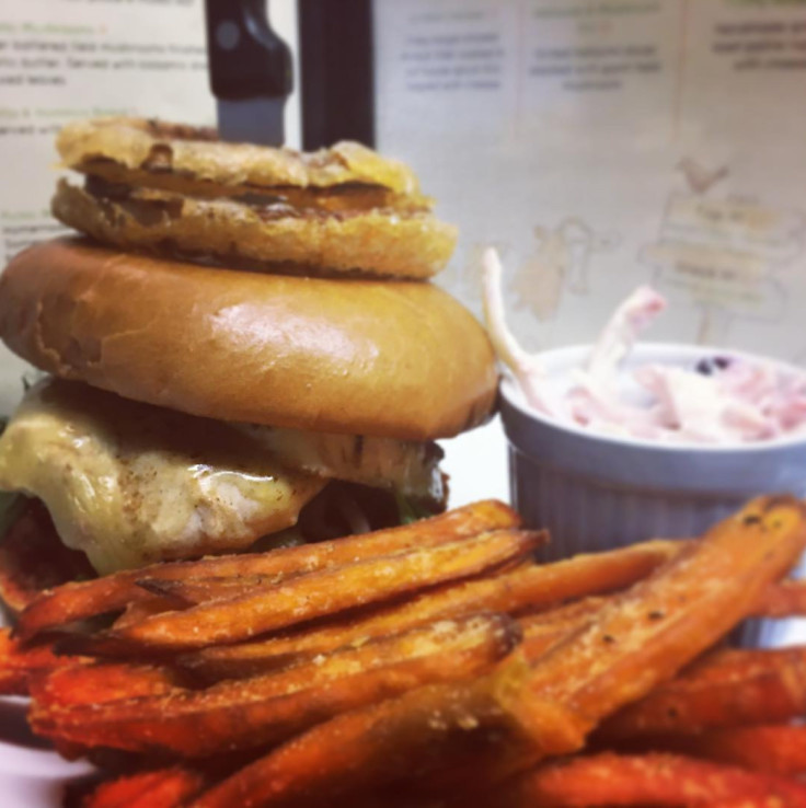 Delicious Grilled Chicken burger topped with Onions Rings - Yum, we know.