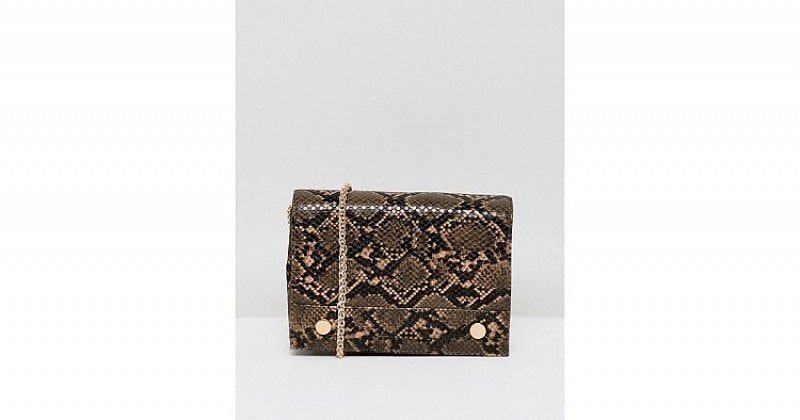 UP TO 50% OFF ALL CHRISTMAS GIFTS - French Connection faux snakeskin envelope back with chain strap!