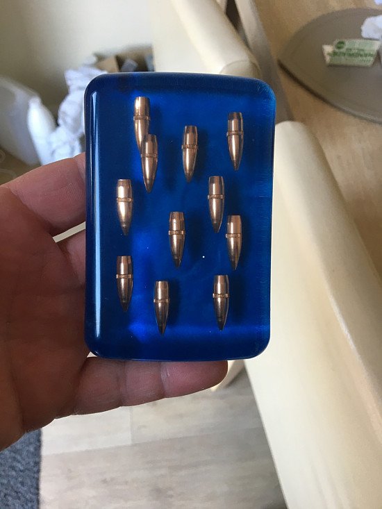 Nato military Nato 7.62 bullet tips set in a resin paperweight
